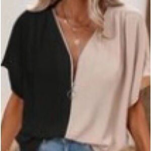 Ladies color block zip up short sleeve blouse. Never worn.  NWOT